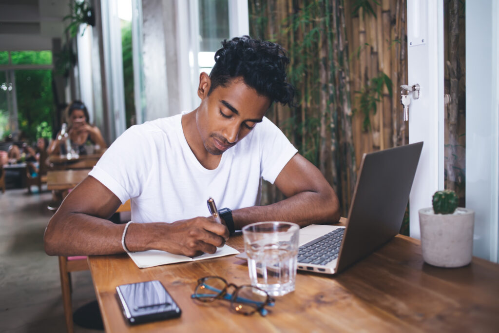 young man in cafe pursuing entrepreneurship 