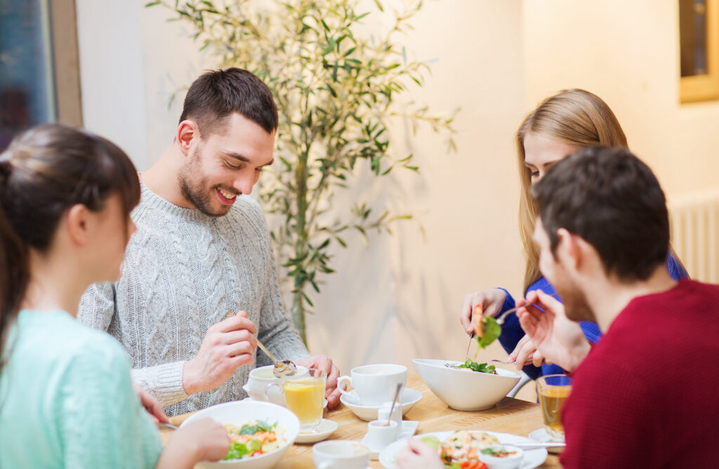 family sitting down eating finding meaning through connecting