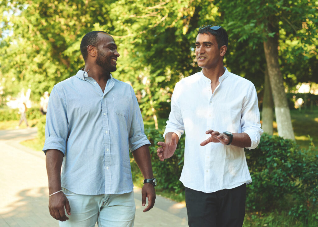 two male friends sharing stories of vulnerability strengthening connection