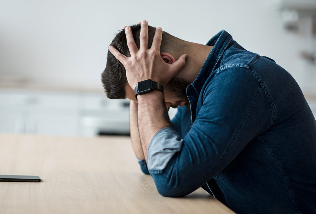 young man struggling with stress and belief systems 