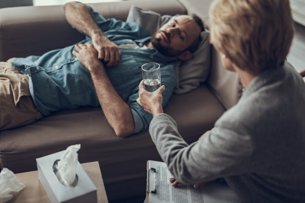 man speaking with therapist trying to calm mind