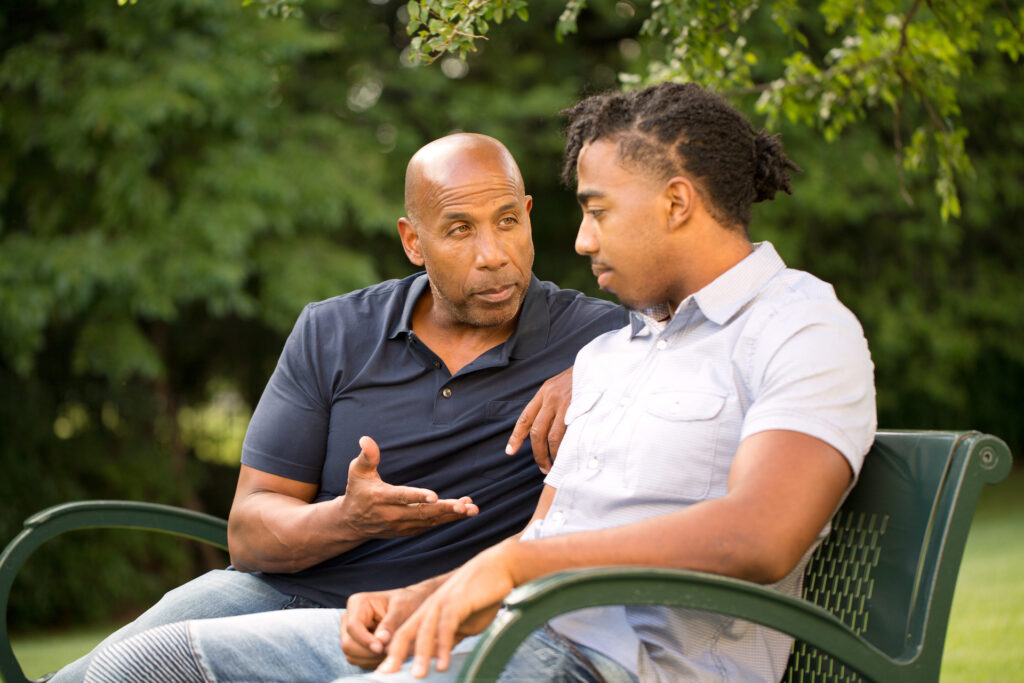 father and son discussing addiction