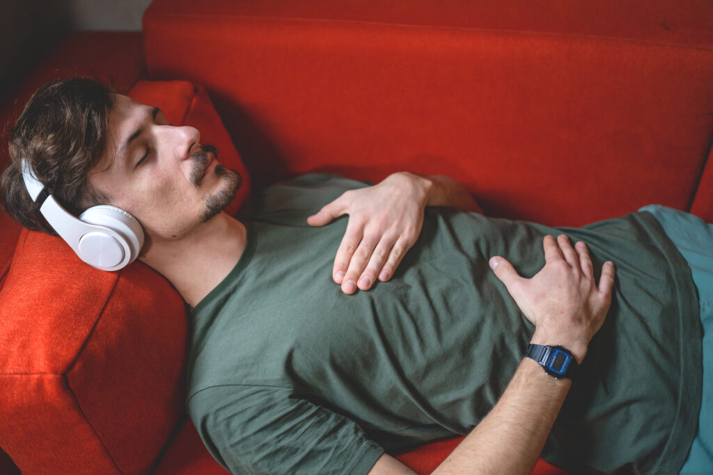 man listening to guided meditation