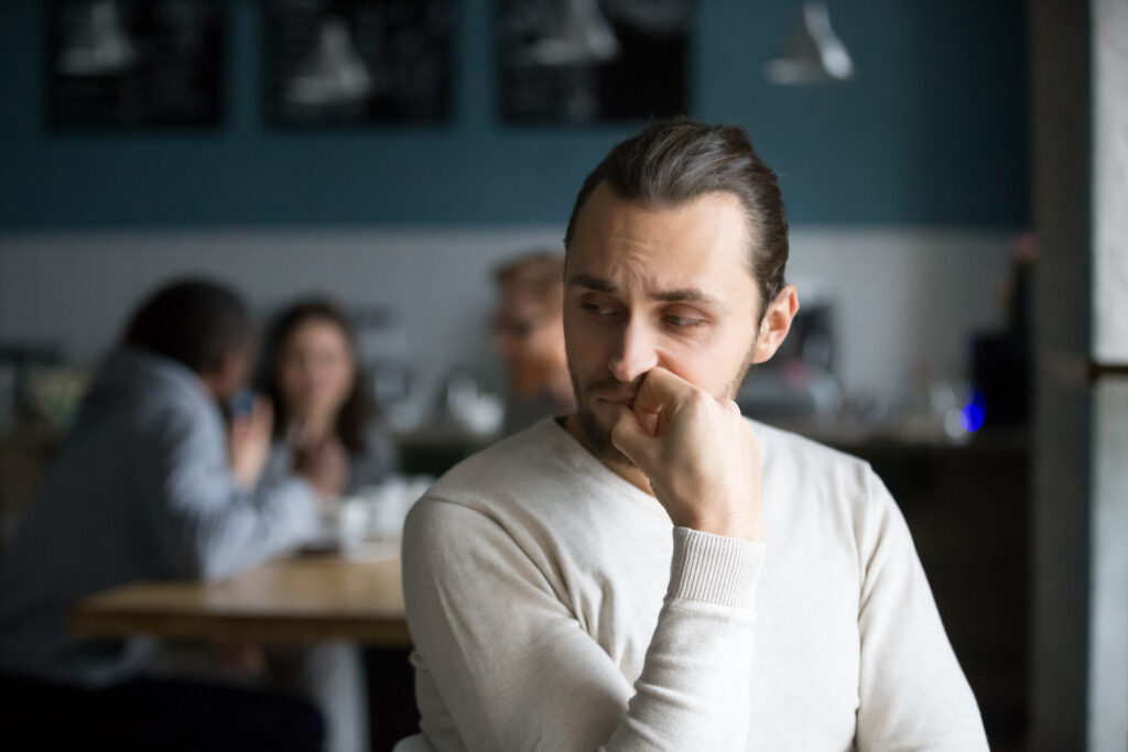 man overthinking in comparison mind trap
