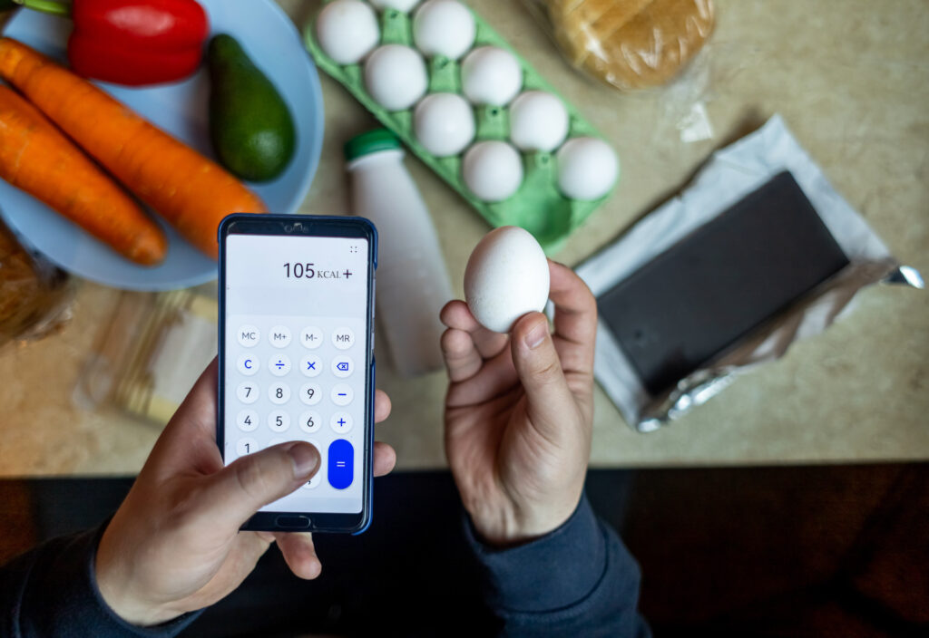 man tracking calories disordered eating