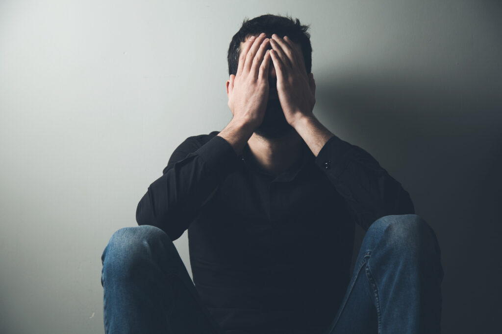 man struggling with PTSD