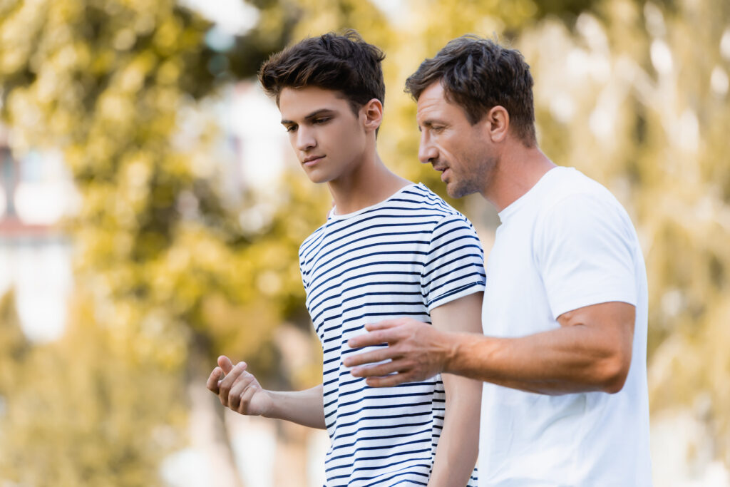 parent talking with children struggle