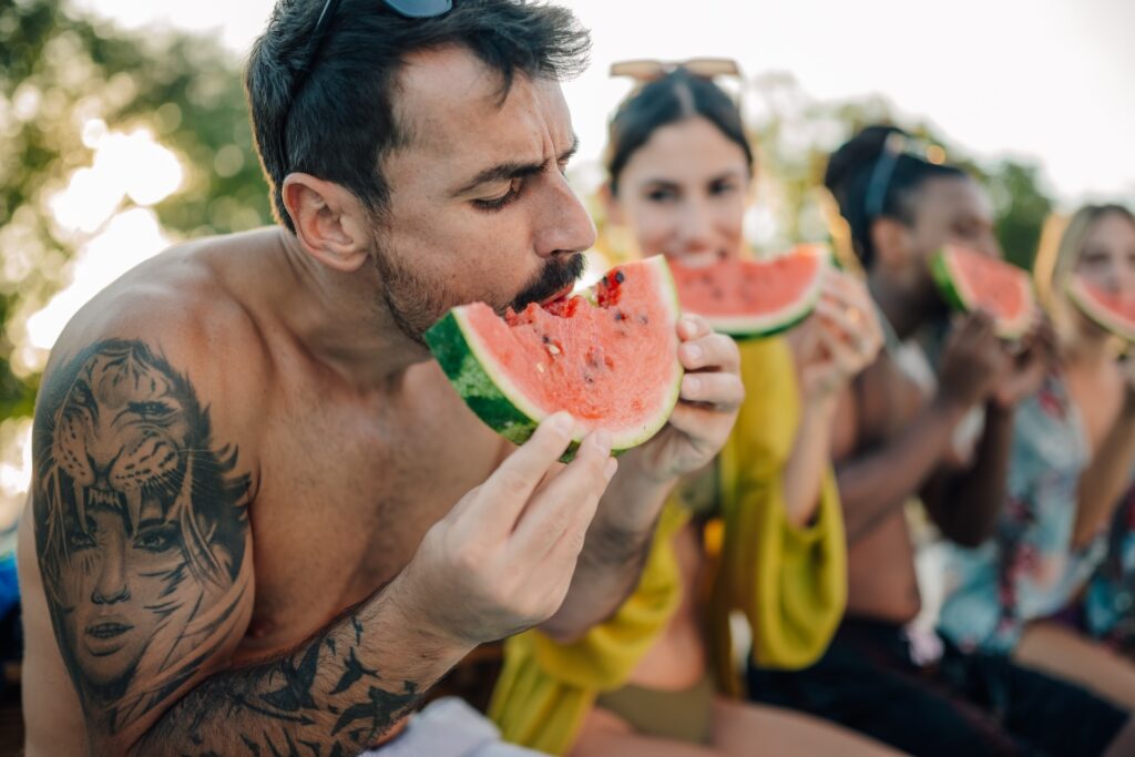 man eating watermelon